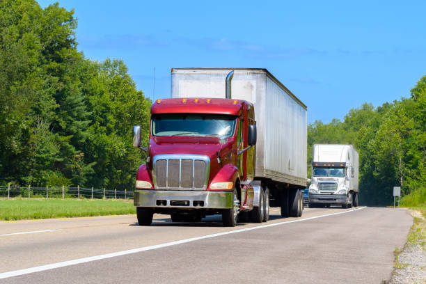 istock Eighteen-Wheeler Trucks On Tennessee Interstate Highway In Summer 2170862236