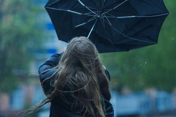 istock Woman under umbrella. Rainy weather 2170866739