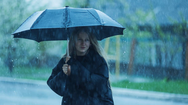 istock Woman under umbrella. Rainy weather 2170866761