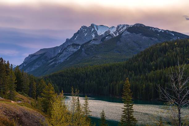 istock Sunrise Clouds Glowing Over Two Jack Lake 2170870396