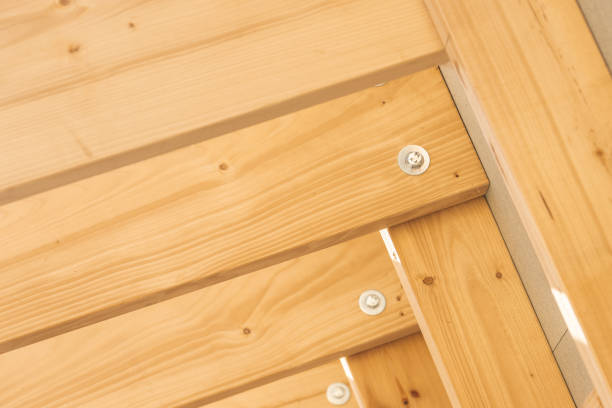 This is a home DIY project or professional installation. This is pressure treated 4x4 post with a connector for a house deck.