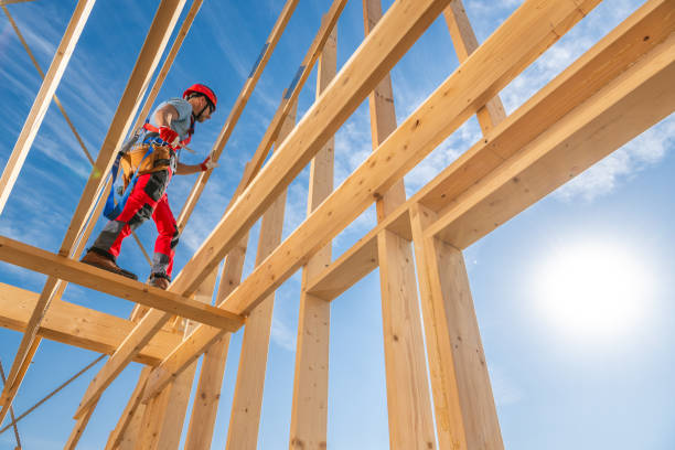 istock Construction Worker Navigating Wooden Beams at a Building Site on a Bright Sunny Day 2170876712