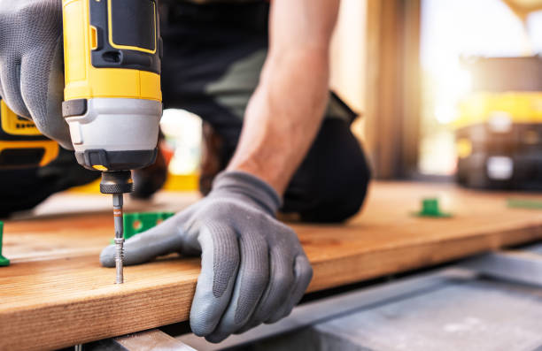 istock A Skilled Worker Uses a Power Drill on Wooden Planks During a Construction Project in Daylight 2170876974