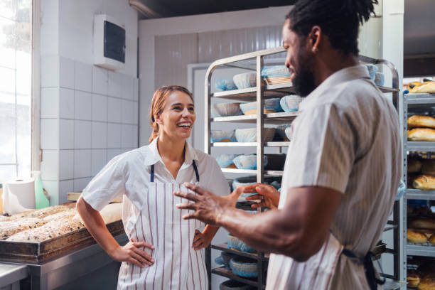 istock Happy Bakers Enjoying a Lively Conversation in the Bakery 2170880517