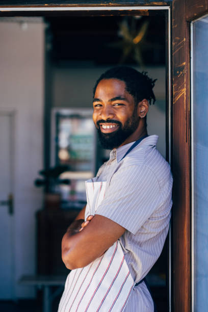 istock Smiling Chef Standing Proudly in Restaurant Doorway 2170880562