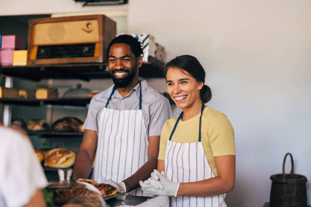 istock Friendly Bakery Staff Smiling Behind the Counter 2170880634