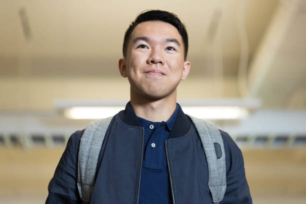 istock Portrait of a young college student walking with his backpack 2170880845