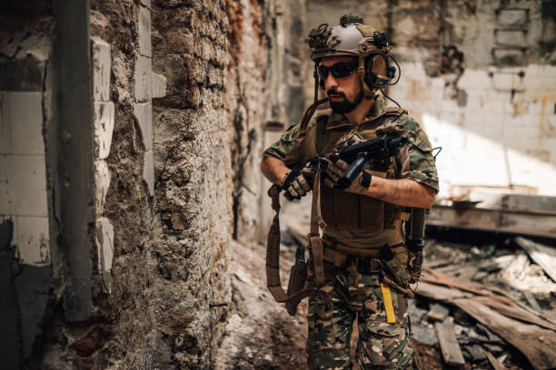 istock Solider with rifle attacking opponent territory in rescue operation. 2170887327