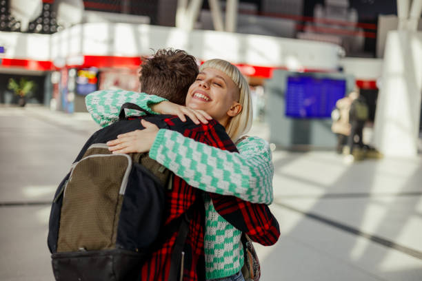 istock Young hipster affectionate couple is hugging at train station. 2170887461