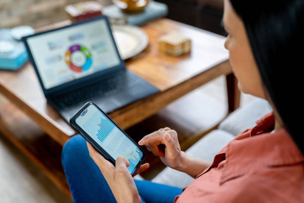 istock Businesswoman working at home on her smart devices 2170888019