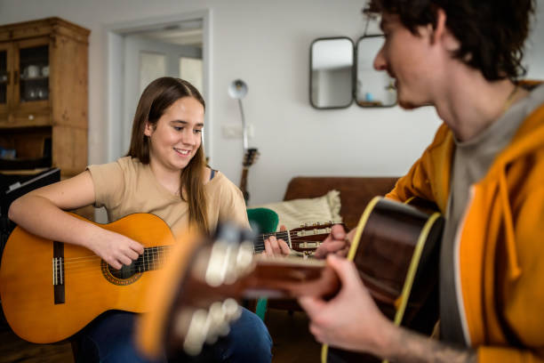 istock Caucasian Music Instructor Gives Private Guitar Lesson 2170888466