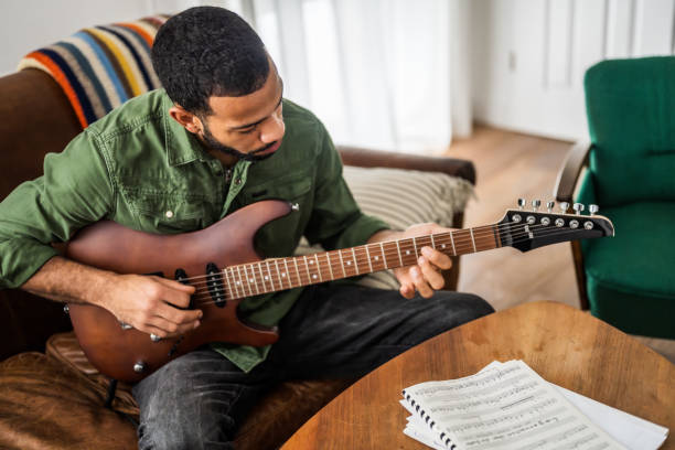 istock Focused Black Musician Playing Electric Guitar Indoors 2170888492