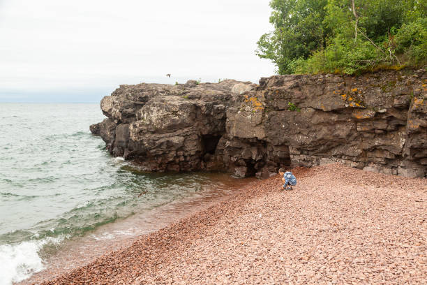close-up view of the iconic sea caves at Meyers Beach, captured from the water during a serene sunset
