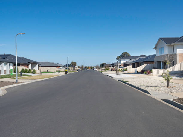 istock Wide street in new housing development 2170897131