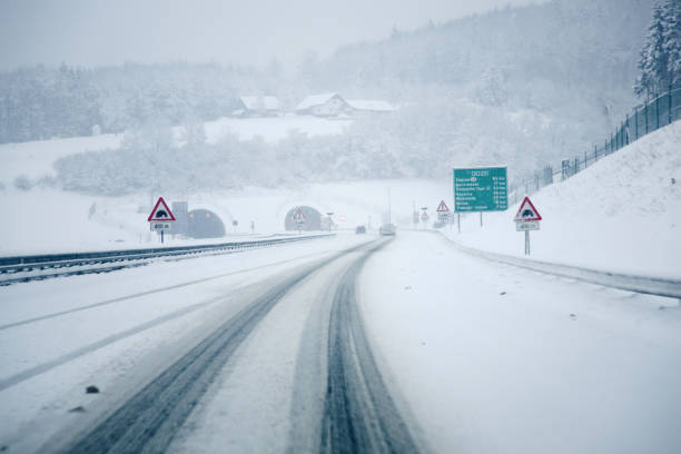 istock Driving on icy highway road during a blizzard 2170897811