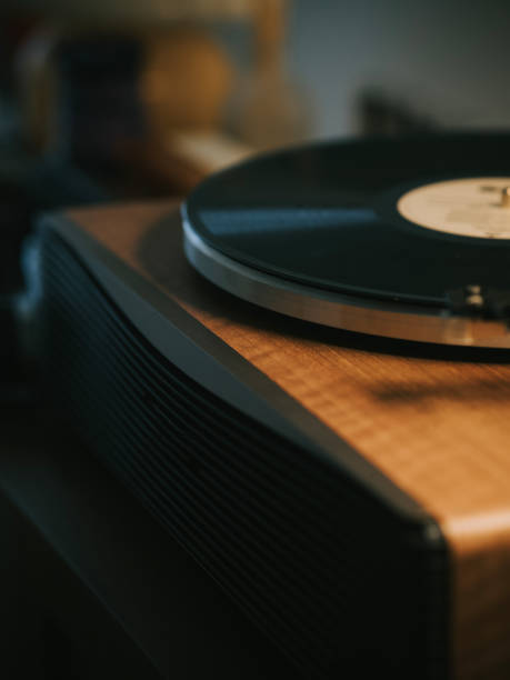 istock Turntable with vinyl record player illuminated in domestic room 2170898155