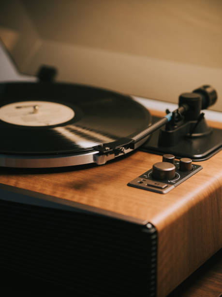 istock Turntable with vinyl record player illuminated in domestic room 2170898166