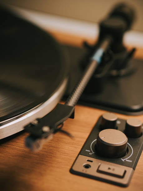 istock Turntable with vinyl record player illuminated in domestic room 2170898167