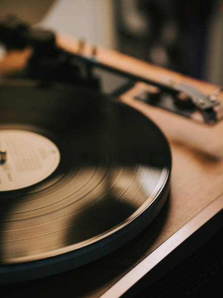 istock Turntable with vinyl record player illuminated in domestic room 2170898168