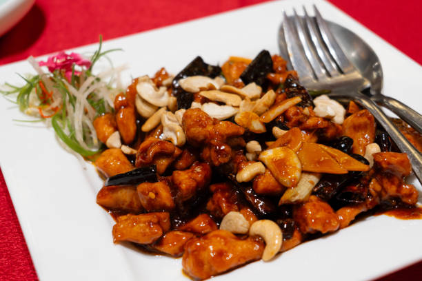 It is a stir-fried dish, which consists of marinated then deep-fried pieces of chicken, dried Sichuan chilli peppers, spicy bean paste, Sichuan peppers, garlic, and ginger.