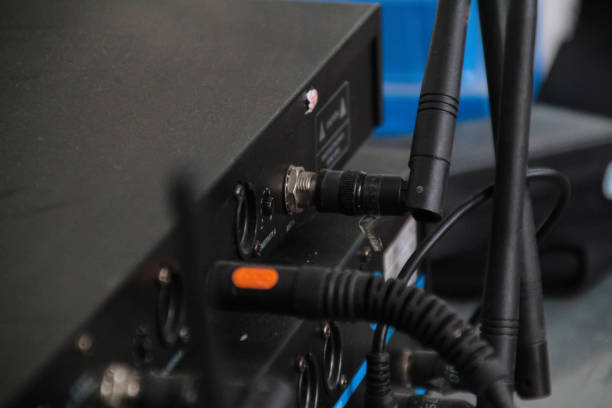 Rear view of the audio mixer machine being connected.