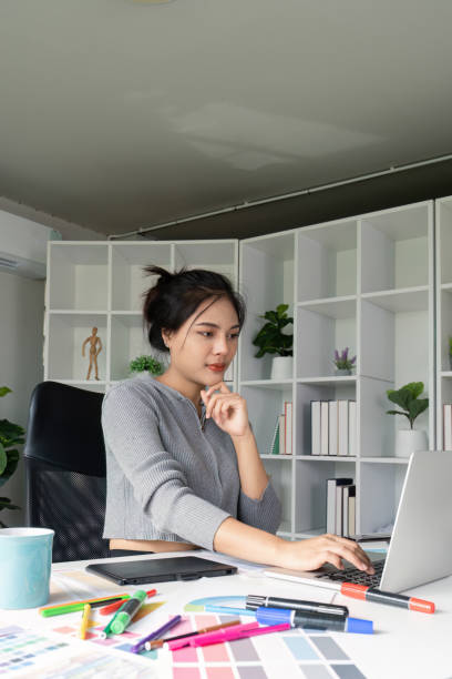 istock Focused graphic designer working on laptop in home office 2170908853