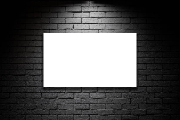 istock Blank advertising billboard on the dark brick wall background 2170908887