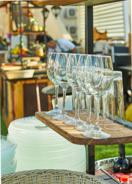 istock Wine glasses and plates at outdoor event 2170910297