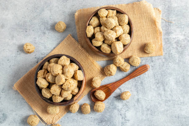 istock Raw soya chunks are dehydrated, protein-rich, plant-based meat substitutes made from defatted soy flour, commonly used in vegetarian dishes. 2170910358