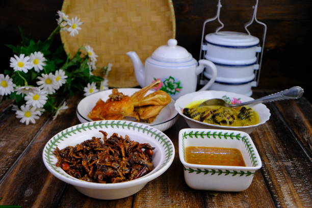 istock malay local cuisine on the wooden table as a menu concept during dinner or lunch translated as lauk melayu. 2170910781