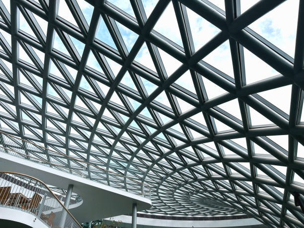 Modern steel structure with glass walls has a beautiful curved design.