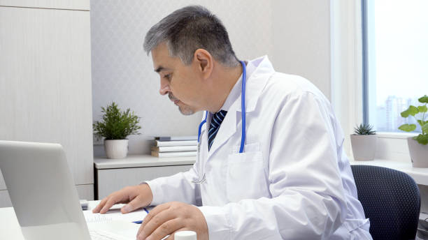 istock Male Doctor Working on Computer in Office 2170912157