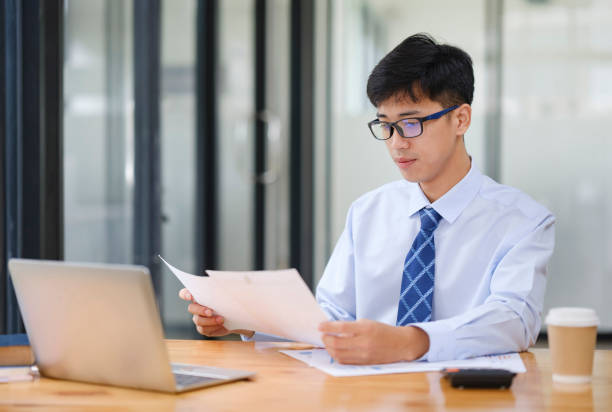istock Businessman Analyzing Risk, Investment, and Market Data in the Office 2170912620
