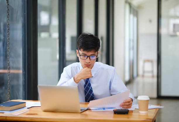 istock Businessman Analyzing Risk, Investment, and Market Data in the Office 2170912621