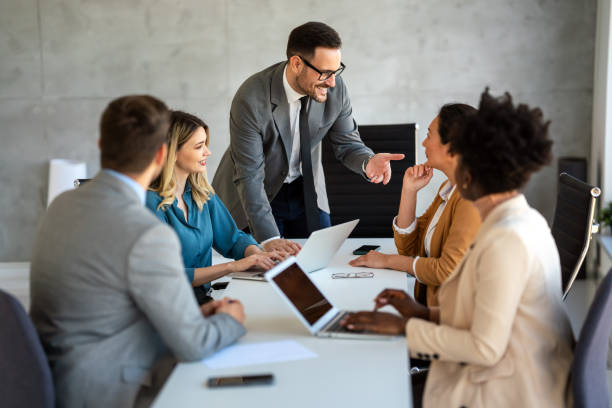 istock Successful multiethnic business people presenting analytical report while working together in office 2170913811