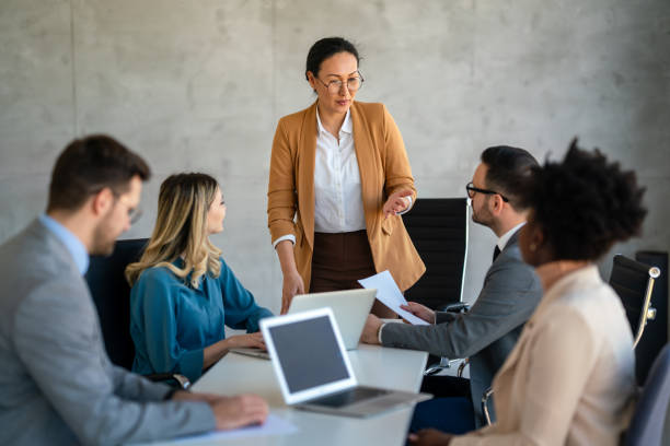 istock Multicultural professional businesspeople working together on research plan in boardroom. 2170914237