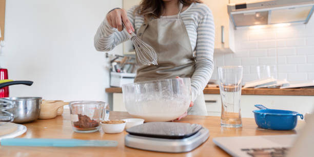 istock Home Baker Whisking Ingredients for Delicious Cake 2170914483