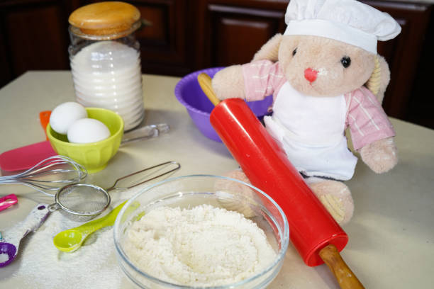 Toy hare cook, rabbit cooks dough at home
