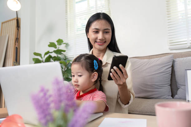 istock Mother Balancing Technology and Parenting at Home 2170914647