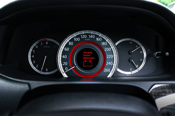A battery charging system malfunction is displayed on the vehicle dashboard screen