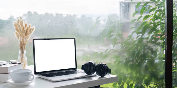 istock Cozy Workspace with Laptop and Headphones by Window 2170916027