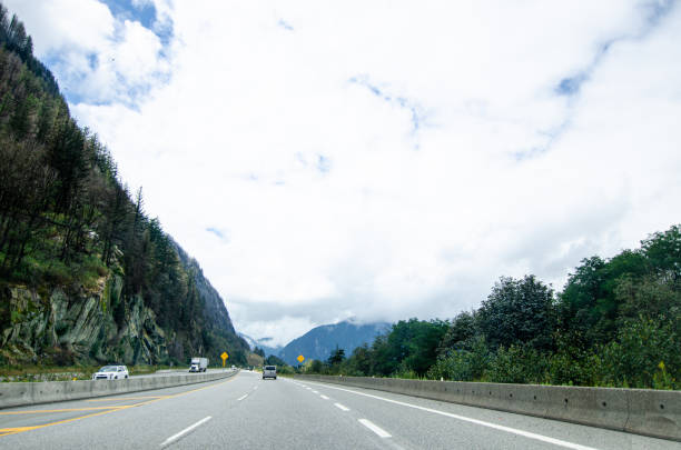 istock Highway in Hope  BC, Canada with cloud covered mountains in the background 2170916398