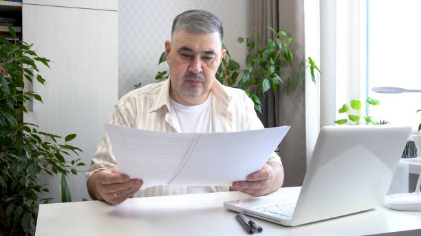 istock Freelancer Reviewing Business Documents in Home Office 2170919210