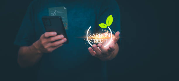 istock Ideas for reducing carbon emissions or using carbon credits for organizations. Businessman showing carbon credit and green business environmental conservation sustainable environmental development 2170920579