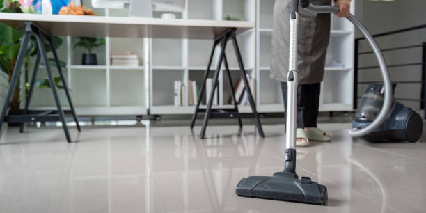 istock Housekeeper cleaning office floor with vacuum for pristine condition 2170922128