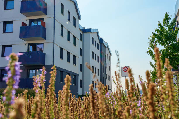 istock Modern Apartment Building with Green Lawn and Trees 2170923128