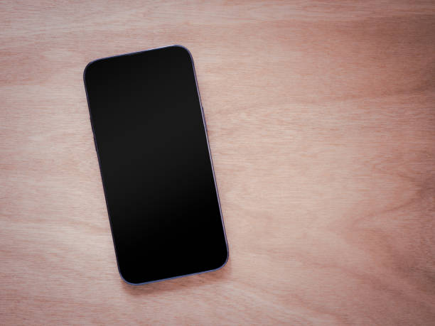 istock Top view, flat lay with copy space. Smartphone mockup screen on wooden background. 2170924298