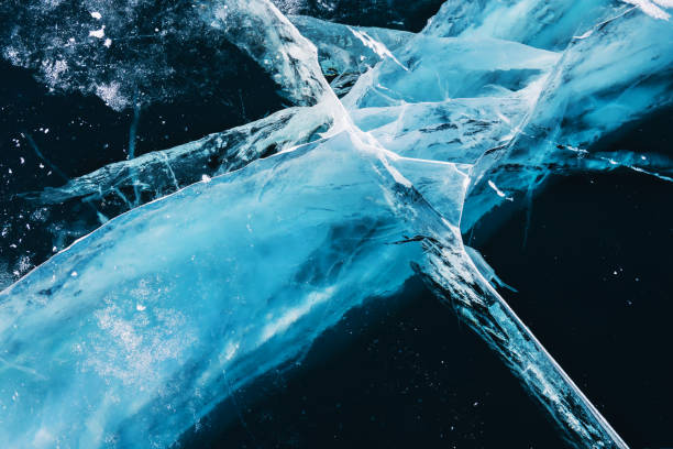 istock Transparent blue ice with cracks on Baikal lake in winter. 2170925443
