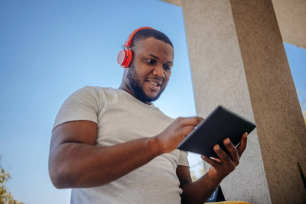 istock People spending day of work enjoying and resting at home while using laptop tablet 2170925660