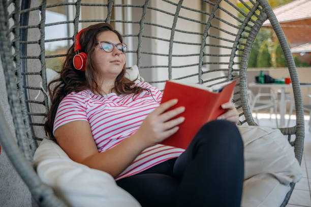 istock People spending day of work enjoying and resting at home reading a book 2170925716